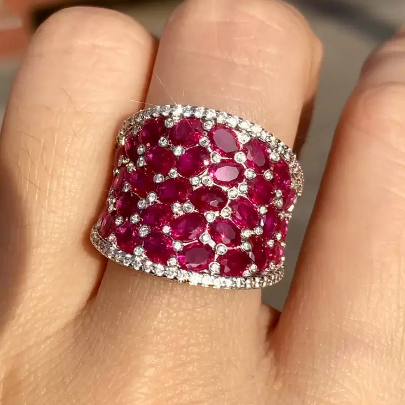 25.5ctw Oval Shaped Ruby Saddle Ring with Diamond Prongs