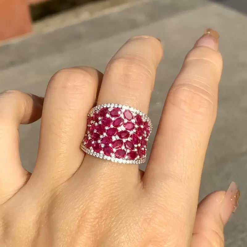 25.5ctw Oval Shaped Ruby Saddle Ring with Diamond Prongs