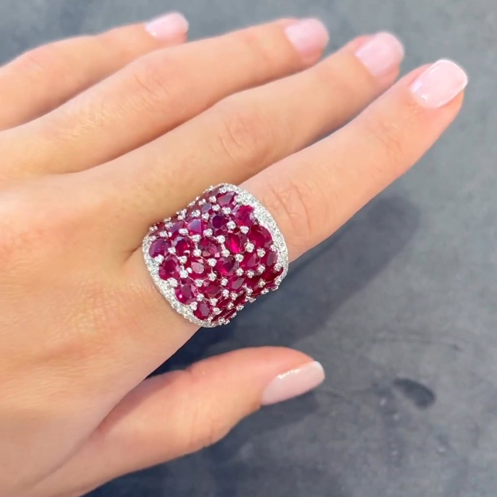25.5ctw Oval Shaped Ruby Saddle Ring with Diamond Prongs