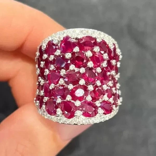 25.5ctw Oval Shaped Ruby Saddle Ring with Diamond Prongs